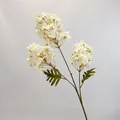 Artificial 3-head hydrangea in cream white with green leaves on grey fabric - Champagne