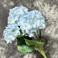 Light blue artificial hydrangea with gradient petals and realistic green leaves - Blue