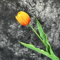 Realistic orange and yellow gradient PU tulip stem with green leaves and moisturizing texture - Sunset Red