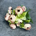 Light pink and cream artificial ranunculus bouquet with green leaves on grey background - Pink
