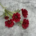 Artificial 6-head zinnia bouquet in deep red with realistic green leaves on grey background - Red