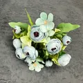 Artificial bouquet with light blue camellia rose buds and green leaves on grey fabric - Light Blue