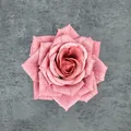 Artificial pink rose flower head with realistic petals on dark stone surface - Dusty Pink