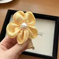 Pale yellow satin flower hair claw clip with a white pearl center for women - Yellow