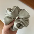 Morandi green scrunchie with white piped edges and elegant satin texture finish - Light Green