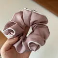 Elegant mauve satin scrunchie with white piped edges and a smooth silky texture finish - Lotus Pink