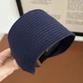 Wide navy blue ribbed knit headband for women with a minimalist elastic fabric design - Navy Blue