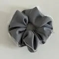 Detail of grey mesh lace scrunchie with soft fabric texture and delicate white pearls - Light Gray