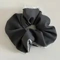 Detail of grey fabric scrunchie with organza lace edges and small pearl embellishments - Dark Gray