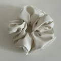 Detail of cream scrunchie with pearl edge trim and delicate lace mesh fabric - Off White