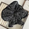 Detail of oversized floral scrunchie featuring vintage black and white print and satin edging - Black