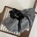Macro detail of oversized layered scrunchie with black and white gingham pleated fabric - Black White Checker