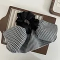 Elegant oversized black satin scrunchie featuring a classic houndstooth bow design - Bowknot Scrunchie / Houndstooth