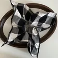 Detail of handmade black and white checkered fabric scrunchie on a wooden tray - Large Plaid