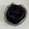 Detailed view of large black organza scrunchie with ruffled layers and rose petal texture - Black