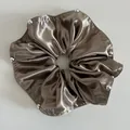 Detail of bronze satin scrunchie featuring smooth texture and silver metallic beads decor - Milk Coffee