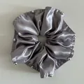 Detail view of grey satin scrunchie with silver bead accents and elegant pleated texture - Smoky Purple