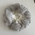 Detail of oversized paisley and cream satin double-layer scrunchie with ruffled texture - Blue