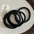 Detailed close-up of high-elasticity black hair ties with matte texture connectors - Simple Multi-strand Style (Style C)