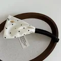 Polka dot satin banana clip with elegant white ribbon and gold metal emblem - Beige Polka Dot