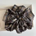 Detailed view of oversized vintage plaid scrunchie in brown flannel fabric - Black/Coffee