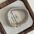 Satin pleated hair scrunchie in champagne silk finish with minimalist matte buckle - Apricot Grey