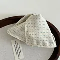 Close-up of cream polka dot fabric hair clip with detailed cotton-linen texture - Off White