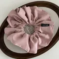 Detail of light pink fabric scrunchie with pleated texture and Hand Made label - Pleated Handmade Label Style / Pink