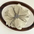 Minimalist puffy cloud hair scrunchie in khaki cotton fabric on a wooden tray - Matcha Green