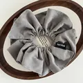 Grey handmade fabric scrunchie with white stitching and signature Hand Made label - Pleated Handmade Label Style / Light Gray