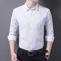 Formal slim fit long sleeve white business shirt for men paired with a dark leather belt - S / Tops / White Long Sleeve Blouse