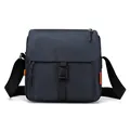Waterproof dark blue nylon messenger bag with black buckle and orange brand label - Navy Blue