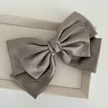 Elegant large triple-layer grey satin bow hair clip featuring a secure spring barrette - Khaki