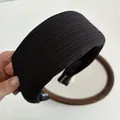 Padded black wide headband with ribbed texture fabric for a stylish face-framing look - Black