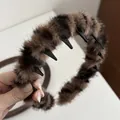 Detail of leopard print plush headband featuring internal anti-slip comb teeth design - Light Coffee Leopard