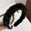 Detailed view of black plush wavy headband showing the built-in plastic anti-slip teeth - Black