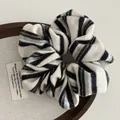Knitted striped scrunchie in black green and blue yarn for a vintage ponytail style - Beige Stripe