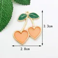 Pendentif cerise DIY avec cadre doré et résine orange en forme de cœur 3,3x2,8cm - Cerise en coeur rose coréen