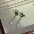 Elegant Korean style butterfly stud earrings with long white teardrop pearl dangles - Butterfly Design Waterdrop Artificial Pearl Tassel Style (E2754-1)