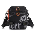 Waterproof tactical crossbody bag in black with orange zipper details and adjustable strap - Black