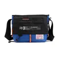 Bandolera de nailon azul y negro con detalles en naranja y correa ajustable - Azul claro