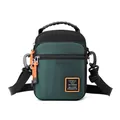 Green outdoor crossbody bag with orange zipper detail and adjustable strap - Dark Green
