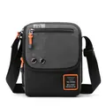 Men's crossbody bag in charcoal grey honeycomb fabric with vibrant orange zipper accents - Gray