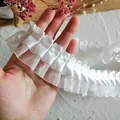 Close-up of white ruffled lace trim with soft pleated chiffon for DIY sewing and clothing - Wide Organza Pleated Style / 3m x 4cm / White