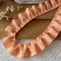 Close-up of orange and white plaid pleated lace trim for DIY sewing and dress decoration - Orange White Plaid Ruffle (Style No. 4)