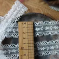 White floral eyelash lace trim measured with a ruler to show the 3cm width detail - Style Five Standard Wide
