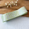Light green holographic magic ribbon featuring witch hats and broom patterns for DIY crafts - Fruit Green