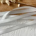 White satin ribbon with silver metallic edges for DIY crafts and gift wrapping - Off-White Silver Edge