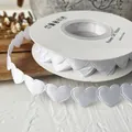 Continuous white heart-shaped polyester ribbon on a spool for DIY craft gift wrapping - Heart Shape / White