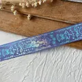 Detail of deep purple ribbon with laser-printed patterns of crown, snake and bow - Snake King (Silver Pattern) / Violet